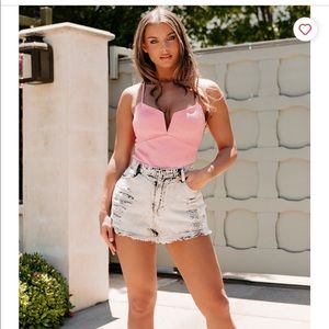 Bright pink body suit